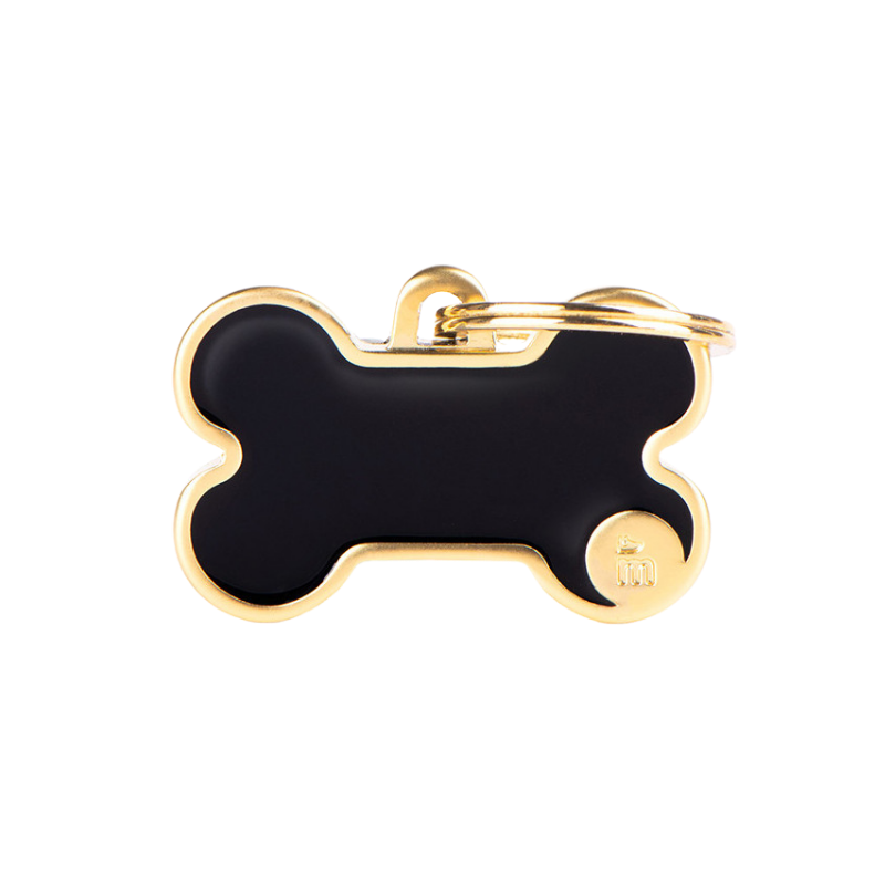 Médaille en forme d'os noir avec contour doré